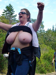 Mature plumpers showing their big tits on public event